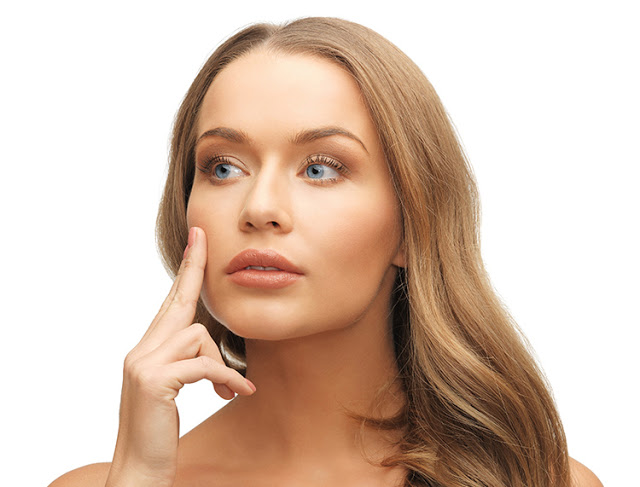 bright picture of beautiful woman pointing to cheek.